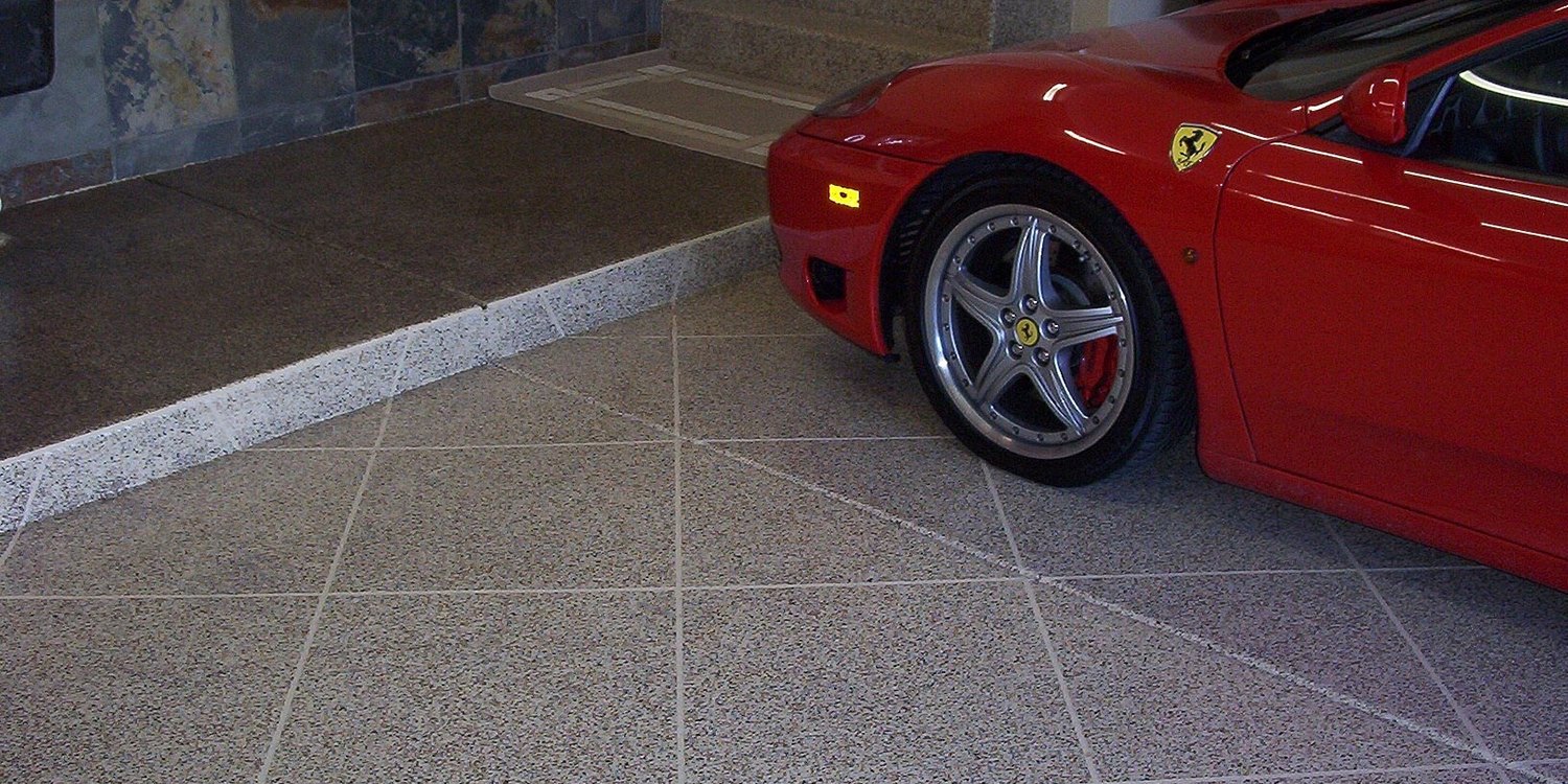 a red ferrari car on the garage